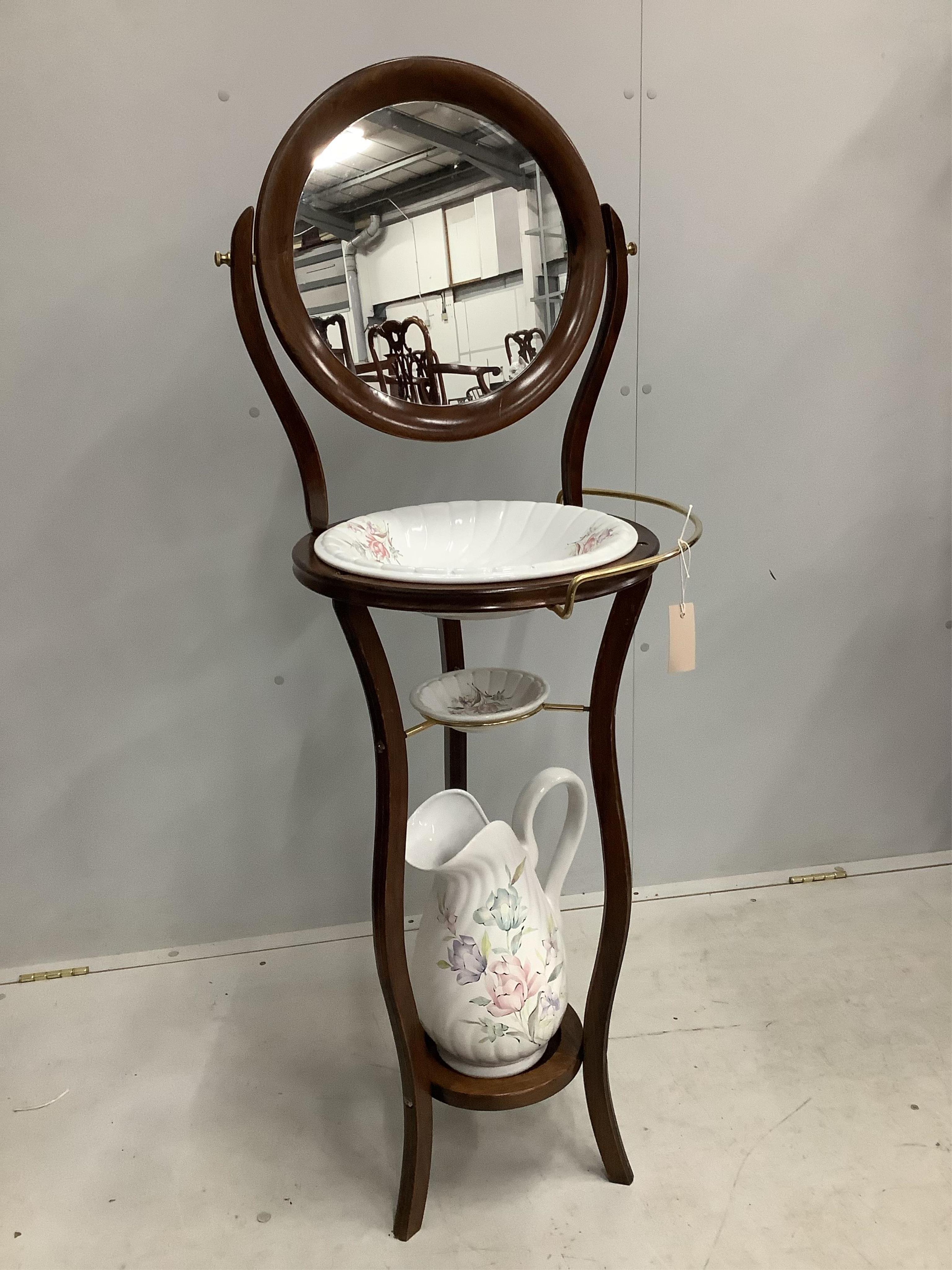 A modern Victorian style stained beech wash stand, with wash jug and basin, width 44cm, height 130cm Condition - good